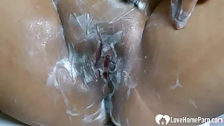 Smoking Asian shaves her beautiful soiled pussy